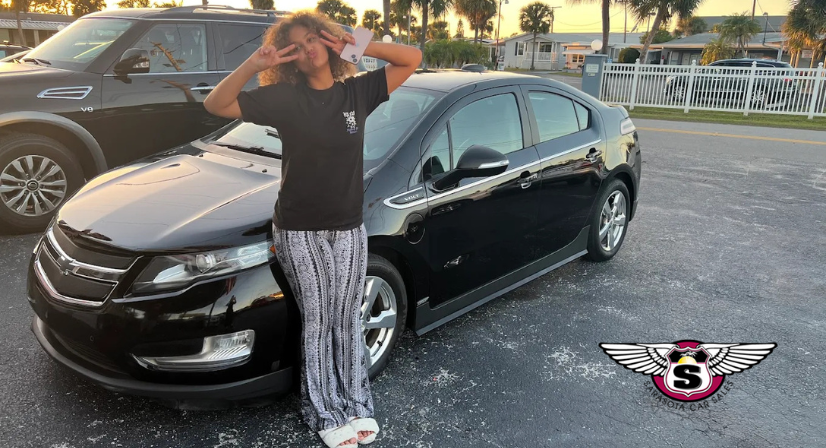 young woman with used chevrolet in sarasota